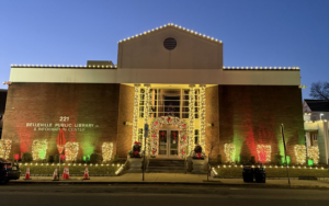 Commercial Christmas light installation on a North Jersey public library with red and green lighting