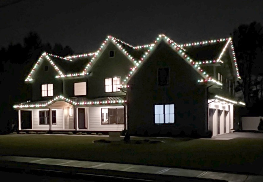 New construction Short Hills NJ home with red and green C9 lights on every roofline
