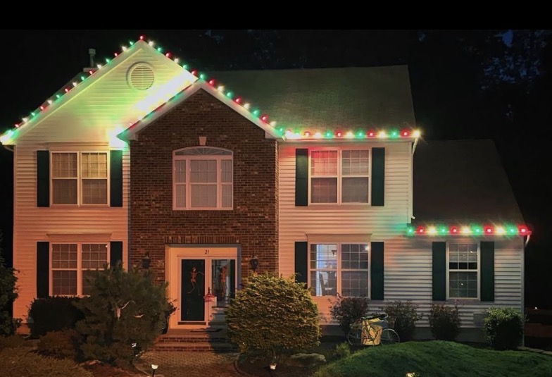 Short Hills NJ home with red and green C9 Christmas lights along the roofline